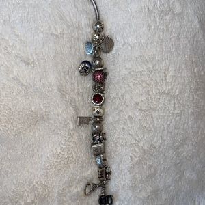 Pandora bracelet with several charms